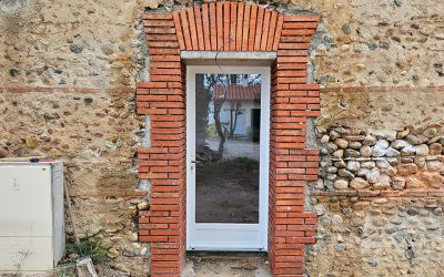 Perçage de porte dans un mur en cayrou
